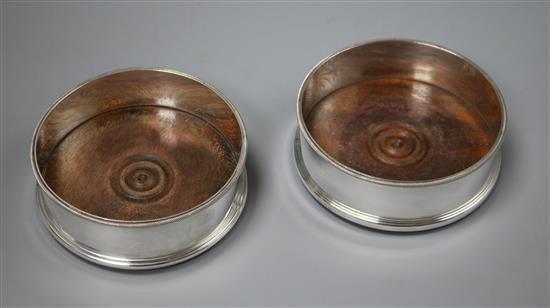 A pair of early 1970s silver wine coasters by C.J. Vander Ltd, 12.2cm.